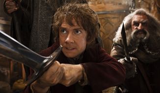 Martin Freeman (left) as Bilbo Baggins joins a quest to reclaim an ancient homeland in &quot;The Hobbit: The Desolation of Smaug.&quot; John Callen plays the character Oin. (WARNER BROS. PICTURES VIA ASSOCIATED PRESS)