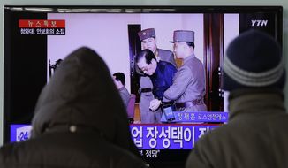 People watch a live TV news program showing that North Korean leader Kim Jong Un&#39;s uncle Jang Song Thaek, second from right, is escorted by military officers during a trial in Pyongyang, North Korea Thursday, Dec. 12, 2013, at the Seoul Railway Station in Seoul, South Korea, Friday, Dec. 13, 2013. North Korea said Friday that it had executed Jang as a traitor for trying to seize supreme power, a stunning end for the leader&#39;s former mentor, long considered the country&#39;s No. 2 official. The letters on the left top, read &quot;North Korea Executed Jang Song Thaek after trial.&quot; (AP Photo/Lee Jin-man)