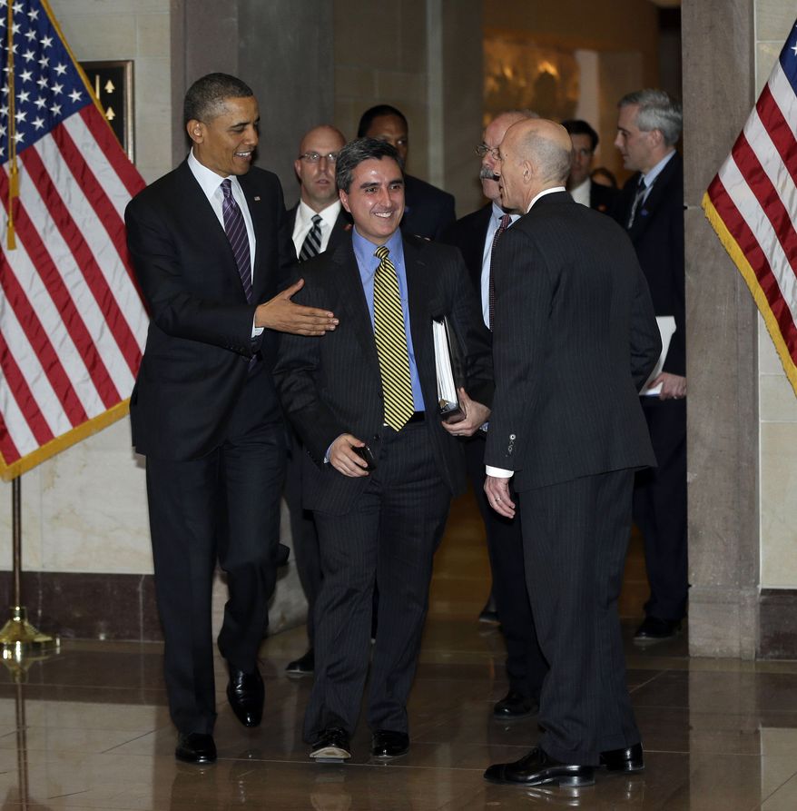 **FILE** President Obama (left), and his director of legislative affairs, Miguel Rodriguez (center), are greeted by the House Sergeant Arms Paul Irving after being escorted by escorted by Senate Sergeant at Arms Terry Gainer, on Capitol Hill to meet with House Democratic Caucus in Washington, on March 14, 2013. (Associated Press)