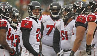 Atlanta Falcons quarterback Matt Ryan huddles up with the offense during an NFL football game against the Green Bay Packers Sunday, Dec. 8, 2013, in Green Bay, Wis. (AP Photo/Matt Ludtke)
