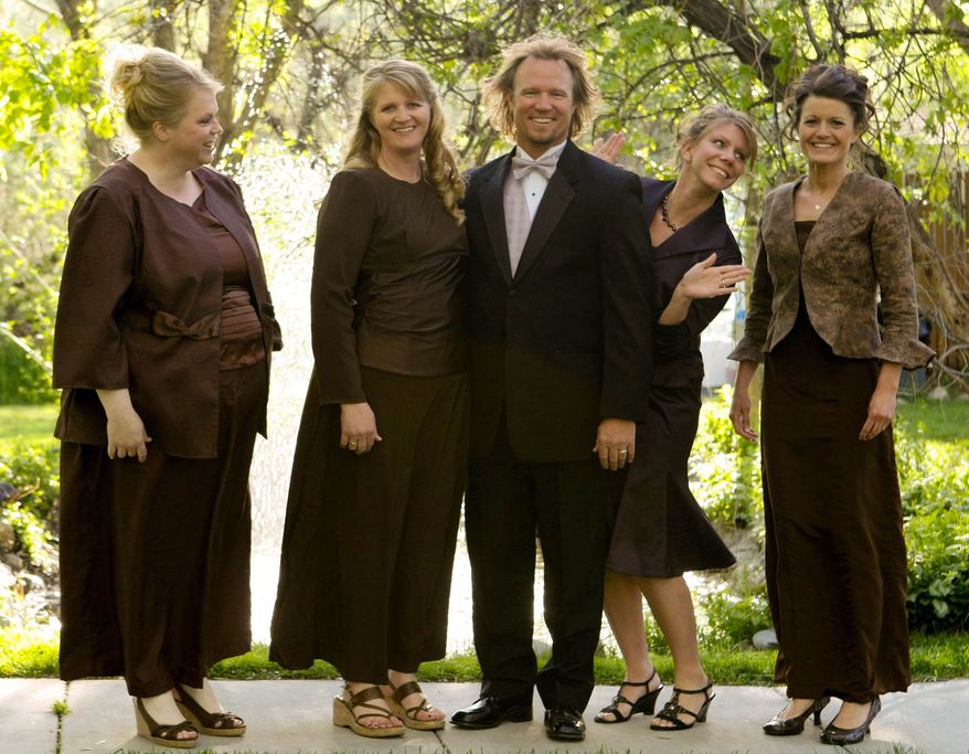 FILE - In this undated file photo provided by TLC, Kody Brown, center, poses with his wives, from left, Janelle, Christine, Meri, and Robyn in a promotional photo for TLC's reality TV show, "Sister Wives." Advocacy groups for polygamy and individual liberties on Saturday, Dec. 14, 2013, hailed a federal judge's ruling that key parts of Utah's polygamy laws are unconstitutional, saying it will remove the threat of arrest for those families. The ruling was a victory for Brown and his four wives and other fundamentalist Mormons who believe polygamy brings exaltation in heaven. (AP Photo/TLC, Bryant Livingston, File)