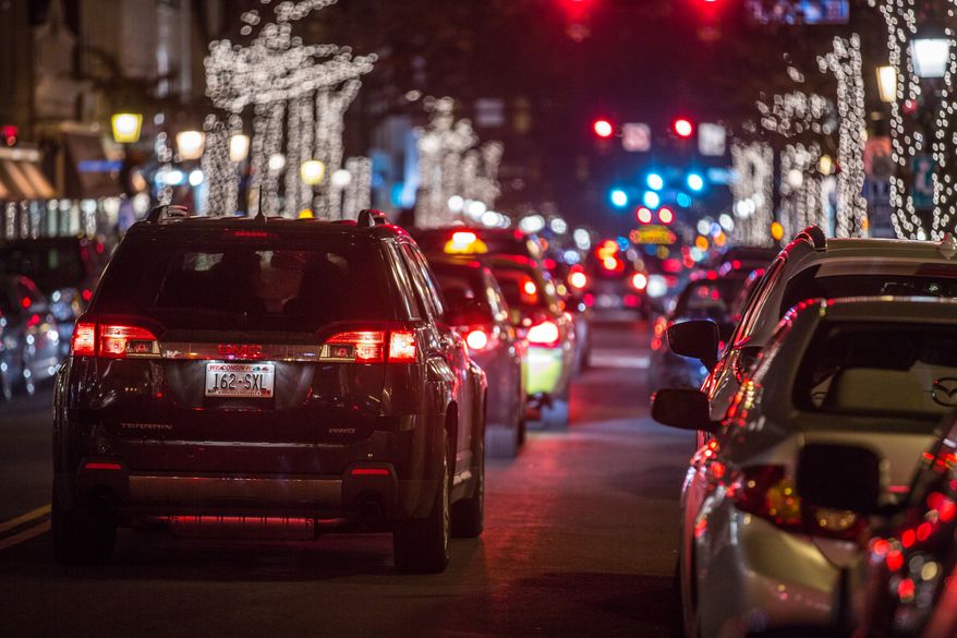 Christmas lights and decorations line the streets of Old Town, in Alexandria, VA., Wednesday, December 18, 2013. (Andrew S Geraci/The Washington Times)