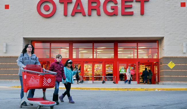 Shoppers leave a retail Target on Thursday, Dec. 19, 2013, in Hackensack, N.J. Target says that about 40 million credit and debit card accounts customers may have been affected by a data breach that occurred at its U.S. stores between Nov. 27 and Dec. 15. (AP Photo/Northjersey.com, Amy Newman) ONLINE OUT; MAGS OUT; TV OUT; INTERNET OUT; NO ARCHIVING; MANDATORY CREDIT