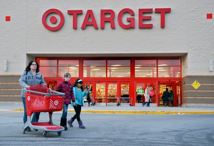 Shoppers leave a retail Target on Thursday, Dec. 19, 2013, in Hackensack, N.J. Target says that about 40 million credit and debit card accounts customers may have been affected by a data breach that occurred at its U.S. stores between Nov. 27 and Dec. 15. (AP Photo/Northjersey.com, Amy Newman) ONLINE OUT; MAGS OUT; TV OUT; INTERNET OUT; NO ARCHIVING; MANDATORY CREDIT