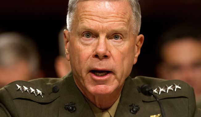 ** FILE ** Marine Corps Commandant Gen. James Amos ordered the officer overseeing a Taliban desecration case to &quot;crush&quot; the defendants shown in a video, court-martial all of them and kick them out of the Corps, according to witnesses. (Associated Press)