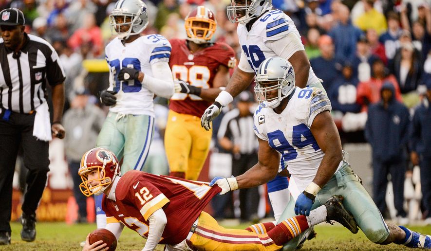 Redskins quarterback Kirk Cousins is stopped short of a first down during the fourth quarter of Sunday&#39;s loss to the Cowboys. Washington has suffered one-point losses in each of Cousins&#39; two starts. (andrew harnik/the washington times)
