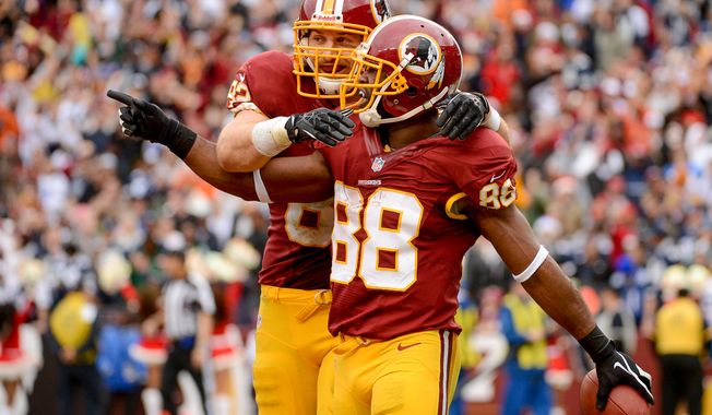 Washington Redskins tight end Logan Paulsen (82), left, celebrates with Washington Redskins wide receiver Pierre Garcon (88) after he catches an eight yard touchdown pass in the third quarter as the Washington Redskins play the Dallas Cowboys at FedExField, Landover, Md., Sunday, December 22, 2013. (Andrew Harnik/The Washington Times)