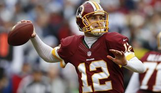 Washington Redskins quarterback Kirk Cousins passes the ball during the first half of an NFL football game against the Dallas Cowboys in Landover, Md., Sunday, Dec. 22, 2013. (AP Photo/Evan Vucci)