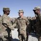 U.S. Maj. Gen. James C. McConville, center, visits troops in Jalalabad, base east of Kabul, Afghanistan, Tuesday, Dec. 24, 2013. (AP Photo/Rahmat Gul) ** FILE **