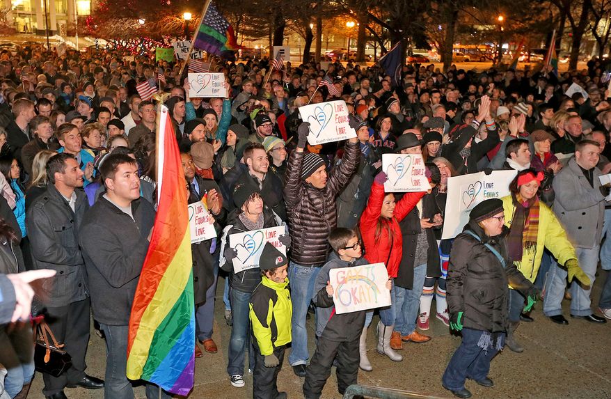 About 1,500 people gather to celebrate marriage equality after a federal judge declined to stay his ruling that legalized same-sex marriage in Utah, at Washington Square just outside of the Salt Lake City and County Building Monday, Dec. 23, 2013, in Salt Lake City. (AP Photo/The Deseret News, Tom Smart)