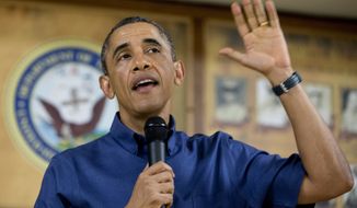 President Barack Obama speaks to members of the military and their families in Anderson Hall at Marine Corps Base Hawaii, Wednesday, Dec. 25, 2013, in Kaneohe Bay, Hawaii. The first family is in Hawaii for their annual holiday vacation. (AP Photo/Carolyn Kaster)