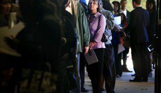 **FILE** Jona Caldwell joins a long line of job seekers outside the Ferguson Community Center in Cordova, Tenn., on Nov. 7, 2013. (Associated Press/The Commercial Appeal, Jim Weber)