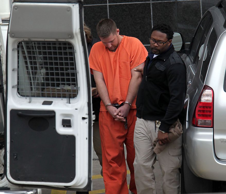 Conrad Alvin Barrett, 27, is escorted out of the Bob Casey Federal Courthouse Friday, Dec. 27,2 013, in Houston. Barrett was arrested the day before on federal hate crimes charges for allegedly shooting video of himself sucker-punching a 79-year-old black man in a "knockout game"-style attack. According to prosecutors, the attack happened Nov. 24 in Katy, but it wasn't until 12 days later that authorities connected the attack to the cellphone video of it. (AP Photo/Houston Chronicle, James Nielsen) MANDATORY CREDIT