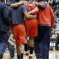 Washington Wizards&#39; Bradley Beal is helped off the court after an injury during the second half of an NBA basketball game against the Minnesota Timberwolves, Friday, Dec. 27, 2013, in Minneapolis. The Timberwolves won 120-98. (AP Photo/Jim Mone)