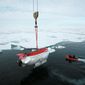 Chilling: In 2007, explorers in the oil-rich Arctic dropped two miniature submarines more than 2 miles beneath the ice at the North Pole to plant a Russian flag on the ocean floor. (Associated Press)