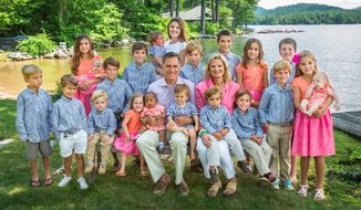Former Republican presidential candidate Mitt Romney tweeted this photo on Christmas Eve of himself and wife Ann with their grandchildren.
