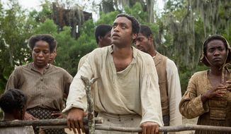 Actor Chiwetel Ejiofor (center) was nominated for a Golden Globe for his performance in &quot;12 Years A Slave.&quot; (Associated Press)