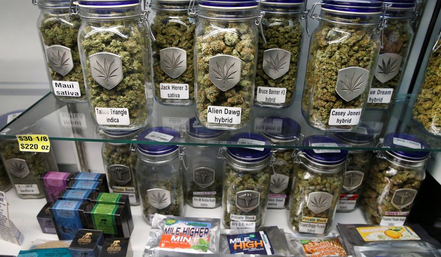 Marijuana and cannabis-infused products are displayed at Medicine Man marijuana dispensary, which is to open as a recreational retail outlet in Denver on Wednesday.