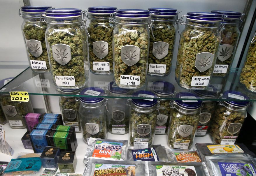 Marijuana and cannabis-infused products are displayed at Medicine Man marijuana dispensary, which is to open as a recreational retail outlet in Denver on Wednesday.