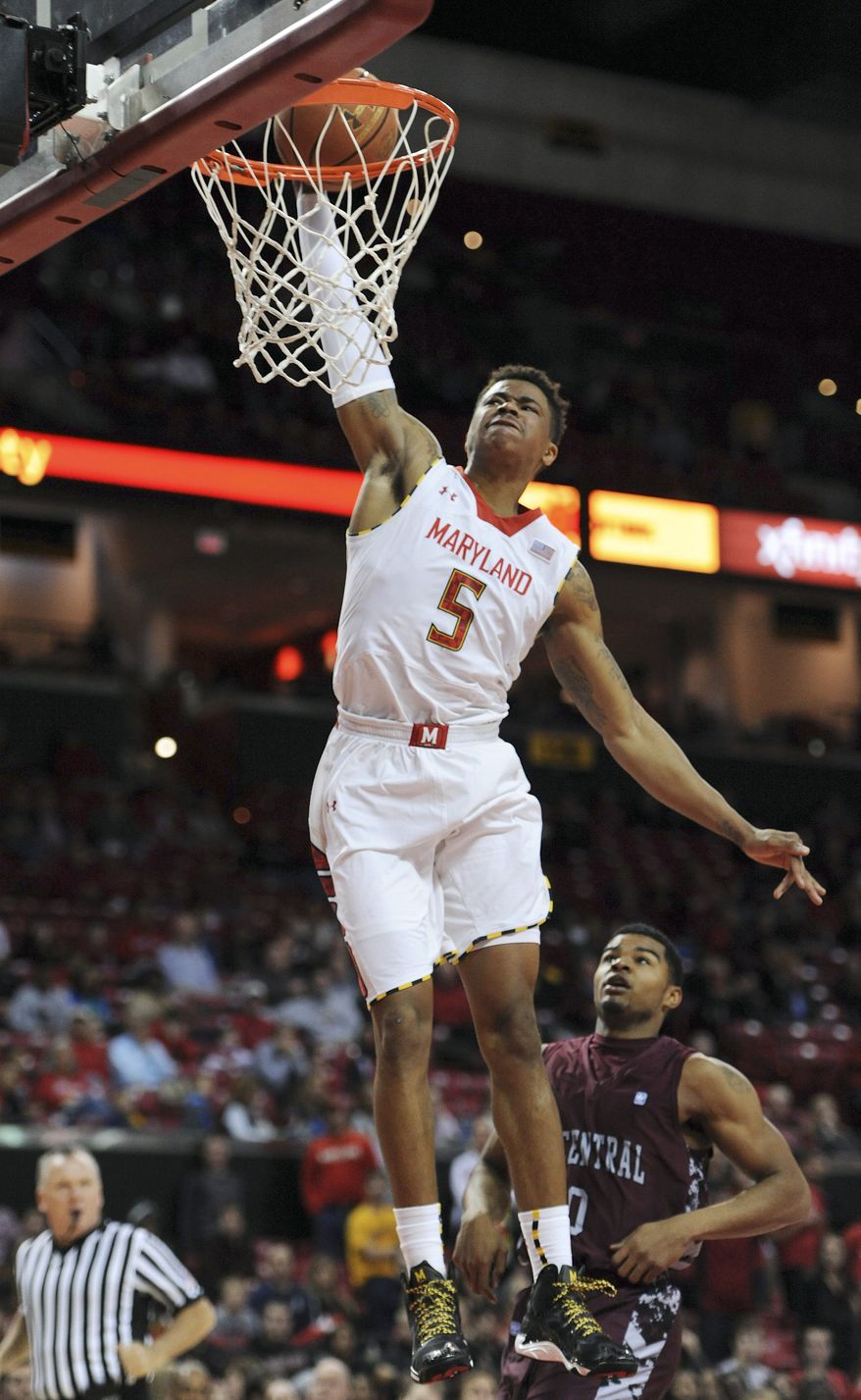 Maryland's Nick Faust dunks the ball to score against North Carolina Central in the second half of an NCAA college basketball game Tuesday, Dec. 31, 2013, in College Park, Md. Maryland won 70-56.(AP Photo/Gail Burton)