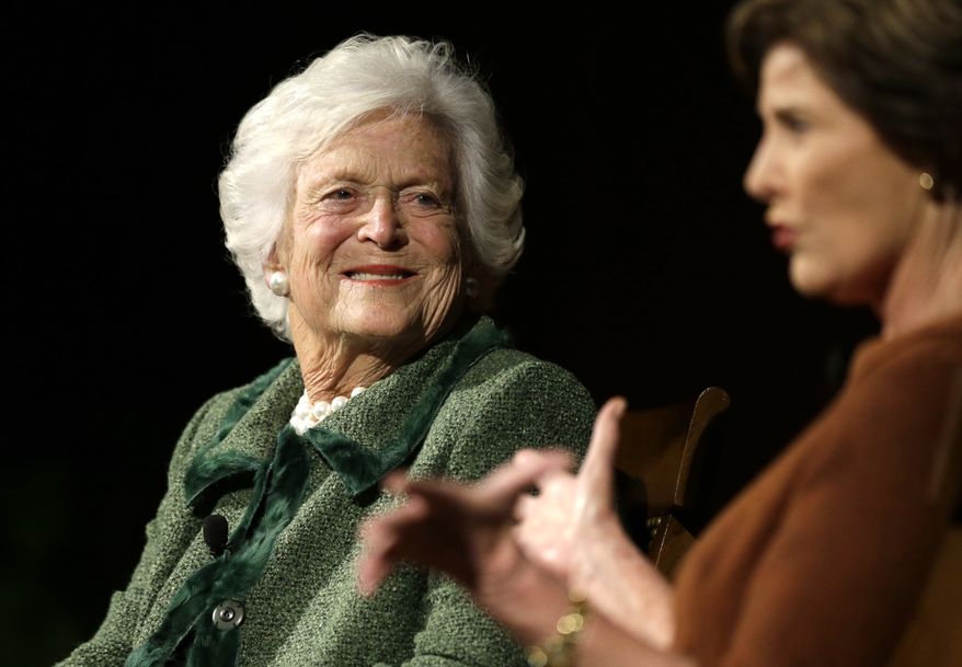 Former first ladies Barbara Bush, left, and Laura Bush, take part in the Enduring Legacies of America’s First Ladies conference Thursday, Nov. 15, 2012, in Austin, Texas. Family members, former staff members, historians, and White House insiders were also spoke as part of the program. (AP Photo/David J. Phillip)