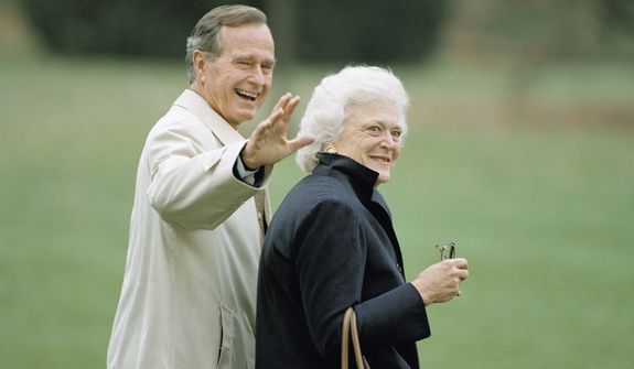 Then-President George H.W. Bush waves as he and first lady Barbara Bush leave the White House in Washington, Nov. 5, 1992, for a weekend trip to Camp David, Maryland. (AP Photo/Wilfredo Lee) ** FILE **