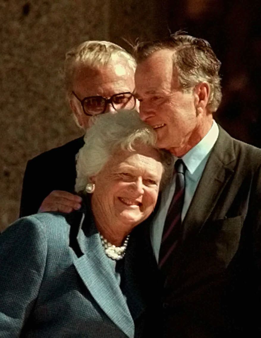 Former President George Bush hugs his wife, Barbara, after his address during the dedicaton of the George Bush Presidential Library in College Station, Texas, Thursday, Nov. 6, 1997. (AP Photo/Pat Sullivan)