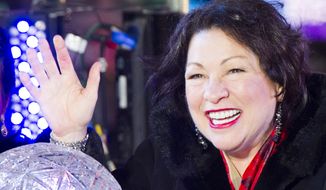 U.S. Supreme Court Justice Sonia Sotomayor pushes the Waterford crystal button that signals the descent of the New Year&#x27;s Eve Ball in Times Square on Tuesday, Dec. 31, 2013 in New York. (Photo by Charles Sykes/Invision/AP)