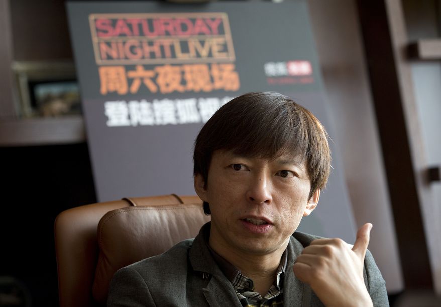 Sohu Chairman and CEO Charles Zhang speaks to the journalists during a press conference at the Sohu Media Plaza in Beijing Thursday, Jan. 2, 2014. A popular online video site has brought American irreverent comedy sketch show Saturday Night Live to China. Sohu Video announced Thursday that it will exclusively show the show that regularly mocks the U.S. government on its website. (AP Photo/Andy Wong)