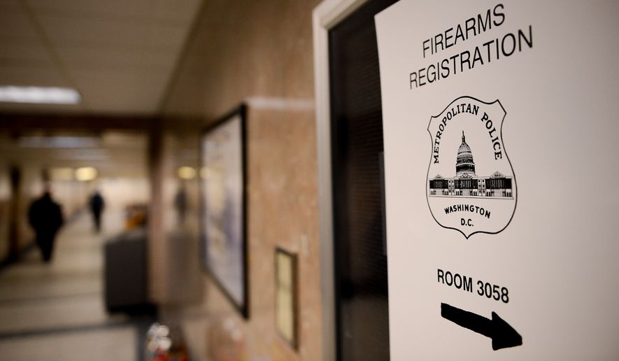 Signs directing to the office of the Firearms Registration Unit at the District&#x27;s Metropolitan Police Department headquarters in Washington, D.C., are seen here Jan. 2, 2014. (Andrew Harnik/The Washington Times) **FILE**