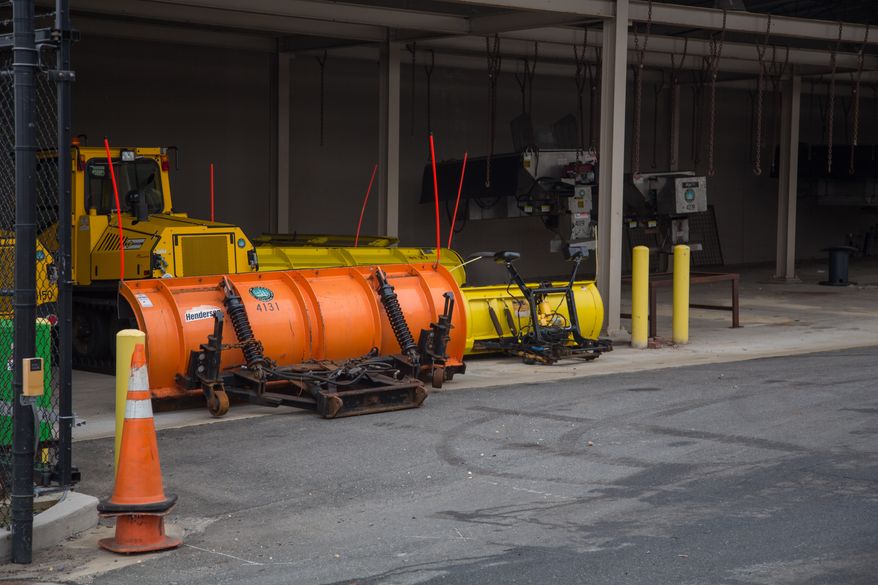 Snow plows wait to be attached to the front of city vehicles as they prepare for the arrival of snow this week, in Alexandria, VA., Thursday, January 2, 2014. (Andrew S Geraci/The Washington Times)