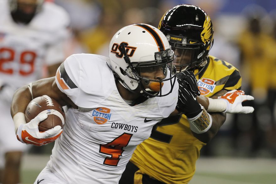 Oklahoma State quarterback J.W. Walsh (4) gets past Missouri defensive back Duron Singleton (2) during the second half of the Cotton Bowl NCAA college football game on Friday, Jan. 3, 2014, in Arlington, Texas. (AP Photo/Brandon Wade)