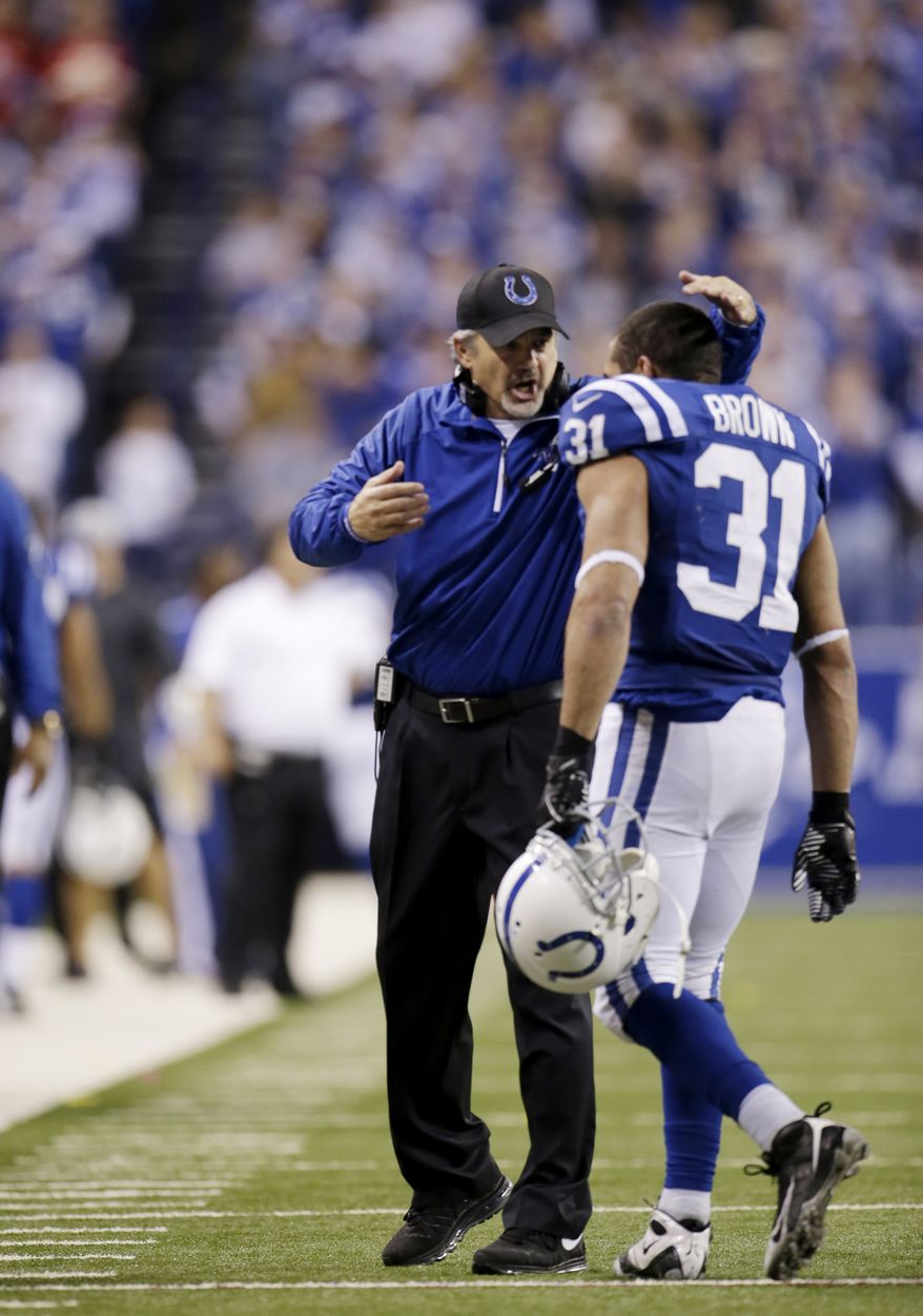 Indianapolis Colts head coach Chuck Pagano gestures to running back Donald Brown (31) during the second half of an NFL wild-card playoff football game Kansas City Chiefs Saturday, Jan. 4, 2014, in Indianapolis. (AP Photo/AJ Mast)