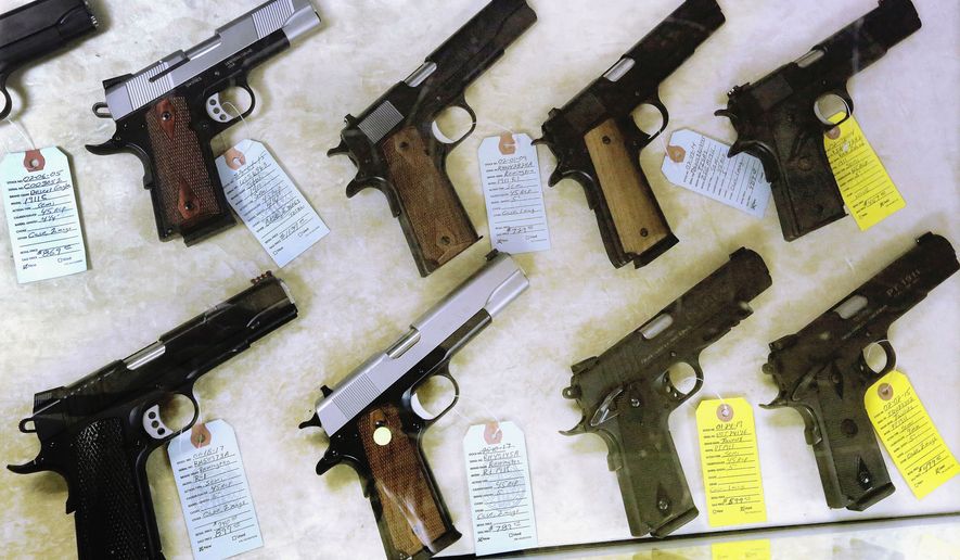 D.C. officials say the opinion issued Wednesday by a Texas federal judge that found unconstitutional a federal ban on the direct sale of handguns from federal firearms dealers to out-of state residents has limited applicability at this time. (AP Photo/Seth Perlman, File)