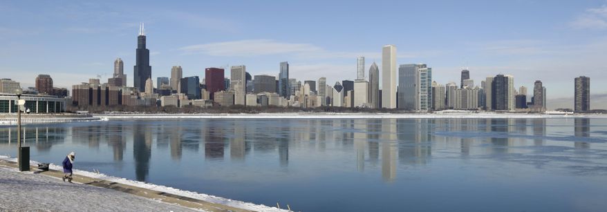Ice floats on the surface of Lake Michigan Friday, Jan. 3, 2014, in Chicago. Single-digit temperatures are hitting Illinois after the state was blanketed in snow. Meanwhile, residents are bracing for a deep freeze. Highs early next week likely won't reach zero and wind chills could sink to 45 below. (AP Photo/M. Spencer Green)