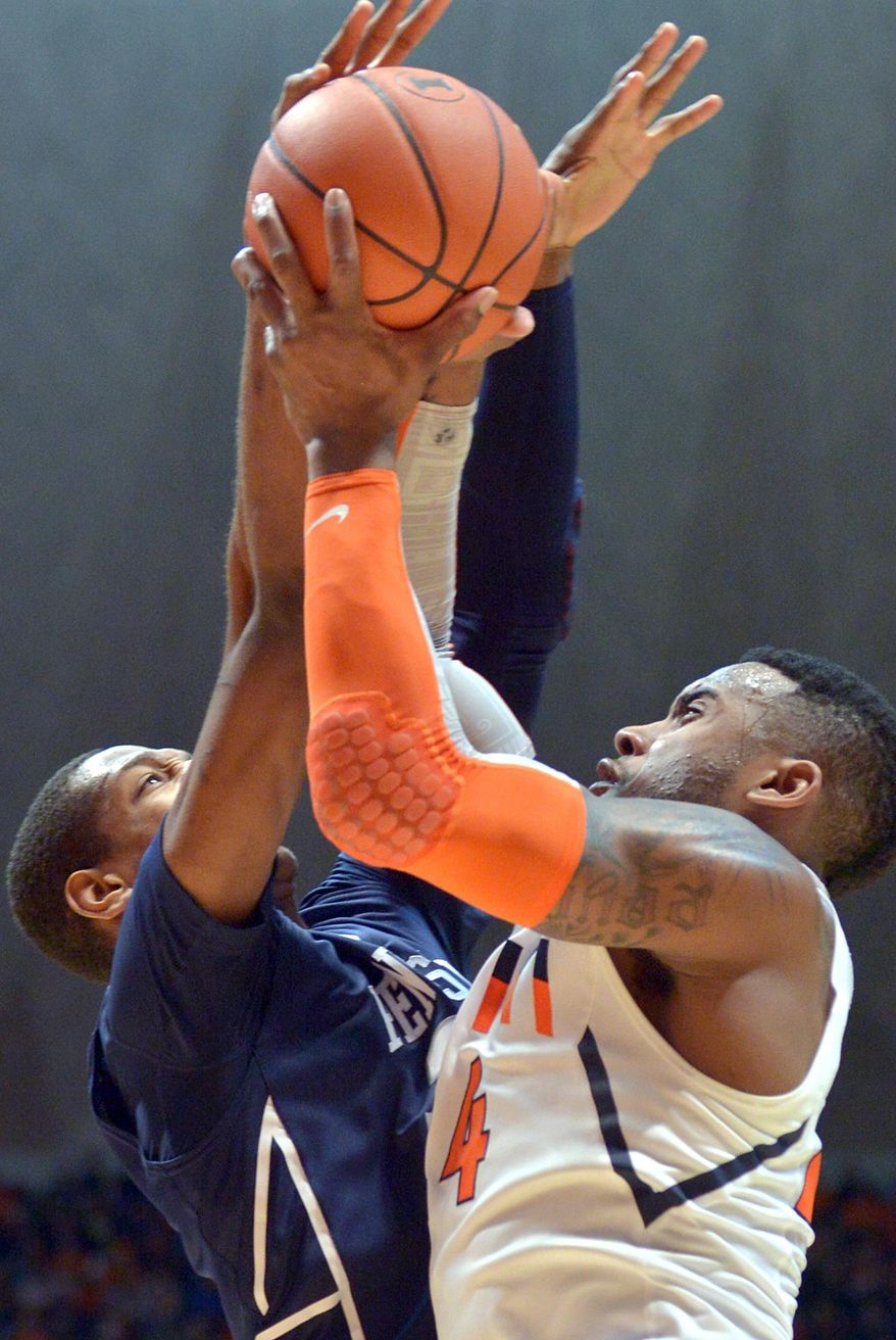 Illinois' Rayvonte Rice, right, shoots as Penn State's Jordan Dickerson defends during an NCAA college basketball game at the State Farm Center in Champaign, Ill., on Saturday, Jan. 4, 2014. (AP Photo/Robin Scholz)