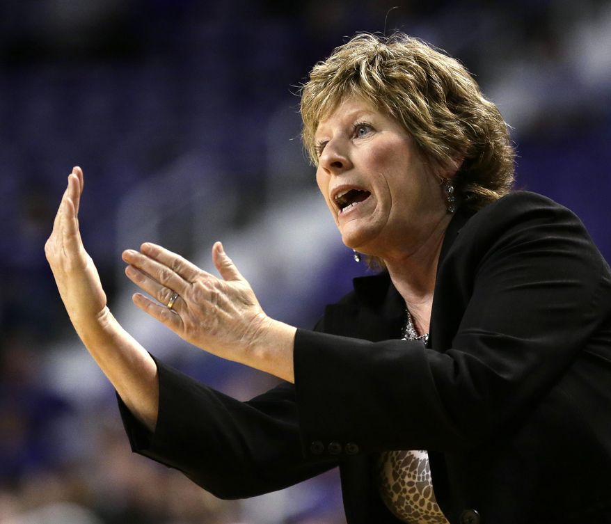 Kansas State coach Deb Patterson talks to her players during the first half of an NCAA college basketball game against Baylor Thursday, Jan. 2, 2014, in Manhattan, Kan. (AP Photo/Charlie Riedel)
