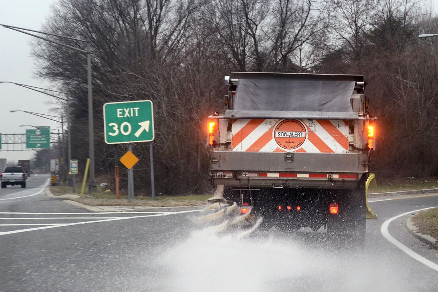A New Jersey Department of Trasnsport truck spreads agent on the off ramp for Lawnsidem N.J., on southbound Interstate 295, Thursday, Jan. 2, 2014, as road crews are once again emptying out the salt domes while the region braces for an old-fashioned snow day. The forecast is calling for around 6 inches in the immediate Philadelphia area, followed by the coldest day in six years with below-zero wind chills. (AP Photo/The Philadelphia Inquirer, Tom Gralish ) PHIX OUT; TV OUT; MAGS OUT; NEWARK OUT