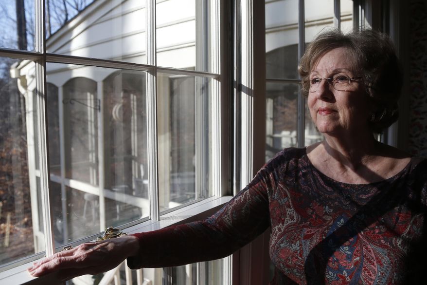 Penny Trusty, 74, a retired software designer and grandmother of five, poses for a photo in her home in Rockville, Md., Thursday, Dec. 26, 2013. Ask people to imagine American life in 2050, and you’ll hear some dreary forecasts. Whether they foresee runaway technology or runaway government, rampant poverty or vanishing morality, a majority of Americans predict a future worse than today. (AP Photo/Charles Dharapak)