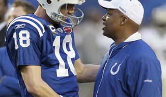 Indianapolis Colts quarterback Peyton Manning (18) talks with Colts head coach Jim Caldwell before the NFL Super Bowl XLIV football game against the New Orleans Saints in Miami, Sunday, Feb. 7, 2010. (AP Photo/Paul Sancya)