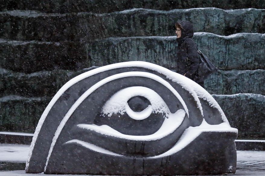 Snow falls in the Cultural District of downtown Pittsburgh during evening rush hour on Thursday, Jan. 2, 2014. A storm expected to bring more than a foot of snow, stiff winds and punishing cold pushed into the Northeast on Thursday, extending Christmas break for some students while posing the first test for New York's new mayor and perhaps the last challenge for Boston's outgoing one. (AP Photo/Gene J. Puskar)