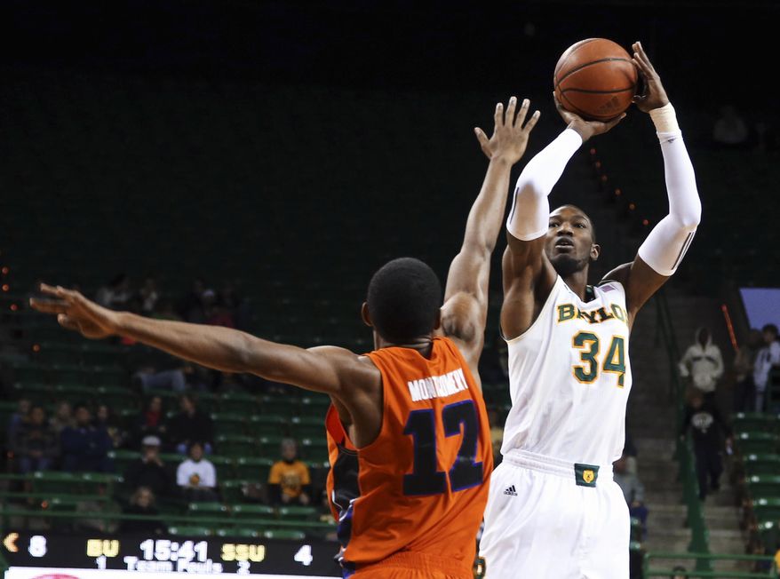 Baylor forward Cory Jefferson (34) shoots over Savannah State forward Joshua Montgomery during the first half of an NCAA college basketball game, Friday, Jan. 3, 2014, in Waco, Texas. (AP Photo/Waco Tribune Herald, Rod Aydelotte)