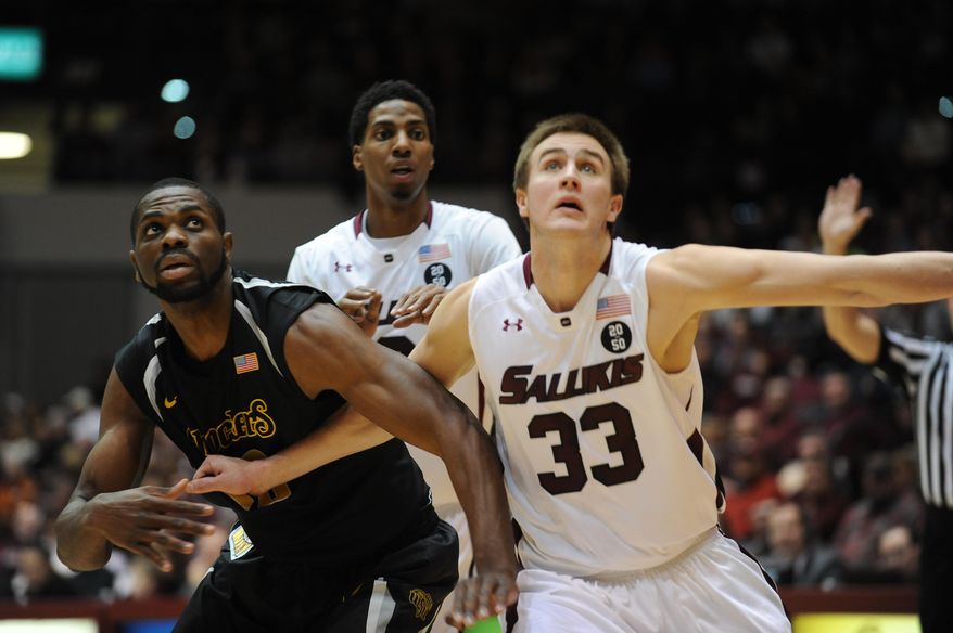 Southern Illinois Sean O'Brien, right, blocks out Wichita State's Kadeem Coleby 20, during the first period of a Missouri Valley Conference NCAA college basketball game in Carbondale, Ill., Thursday, Jan. 2, 2014. (AP Photo/Stephen Lance Dennee)