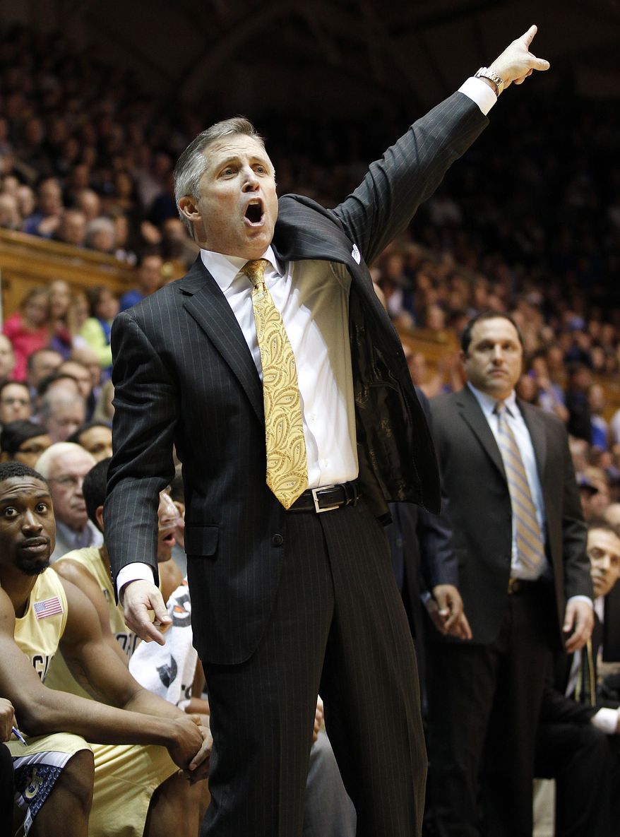 Georgia Tech coach Brian Gregory talks to his players during the second half of an NCAA college basketball game against Duke in Durham, N.C., Tuesday, Jan. 7, 2014. Duke won 79-57. (AP Photo/Ellen Ozier)