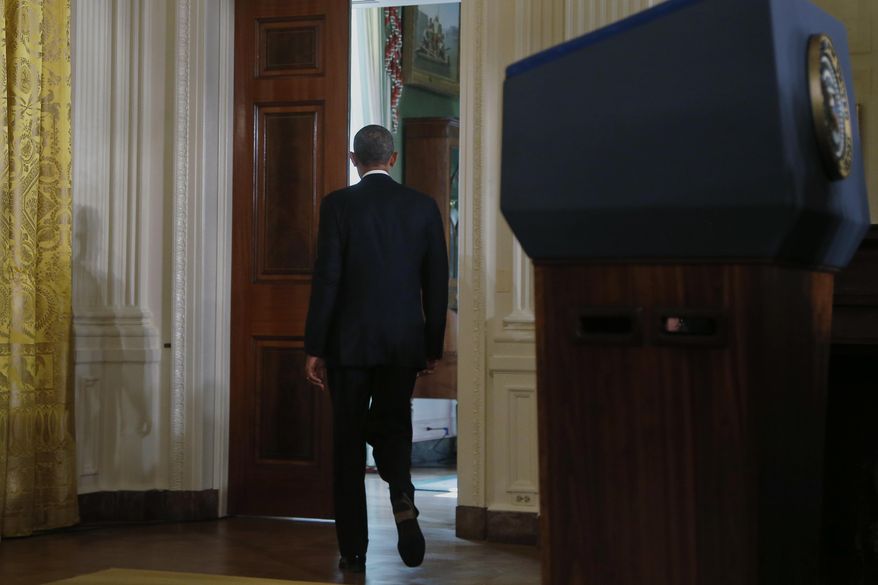 President Barack Obama walks out of the East Room into the Green Room of the White House in Washington after he spoke about benefits for the unemployed, Tuesday, Jan. 7, 2014. The president applauded a Senate vote advancing legislation to renew jobless benefits for the long-term unemployed as an important step. The Senate voted 60-37 Tuesday to clear the bill's first hurdle. But Republicans who voted to move ahead still want concessions that will have to be worked out before final passage. The Republican-controlled House would also have to vote for it. (AP Photo/Charles Dharapak)