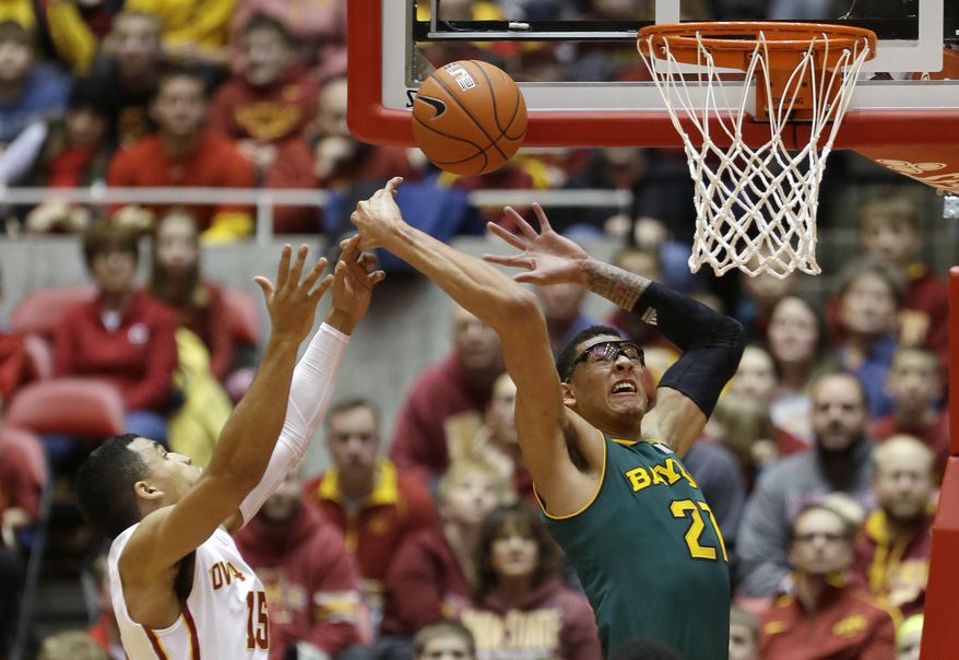 Baylor center Isaiah Austin, right, fights for a rebound with Iowa State guard Naz Long during the first half of an NCAA college basketball game, Tuesday, Jan. 7, 2014, in Ames, Iowa. (AP Photo/Charlie Neibergall)