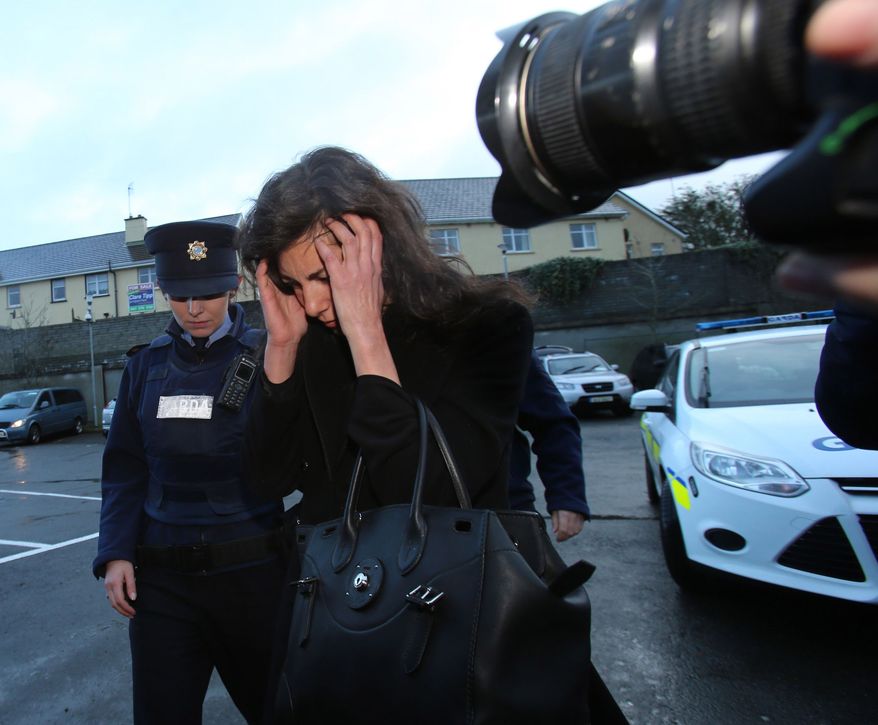 Jenny Lauren, centre, Niece of fashion designer Ralph Lauren, arrives at Killaloe District Court, in Killaloe, Ireland, Tuesday, Jan. 7, 2014. The niece of fashion designer Ralph Lauren has appeared in an Irish court on charges of being drunk and disorderly on a New York-bound plane. Jewelry designer Jenny Lauren was arrested after a Delta flight from Barcelona made an unscheduled stop at Shannon Airport on Monday. (AP Photo/PA, Niall Carson) UNITED KINGDOM OUT NO SALES NO ARCHIVE