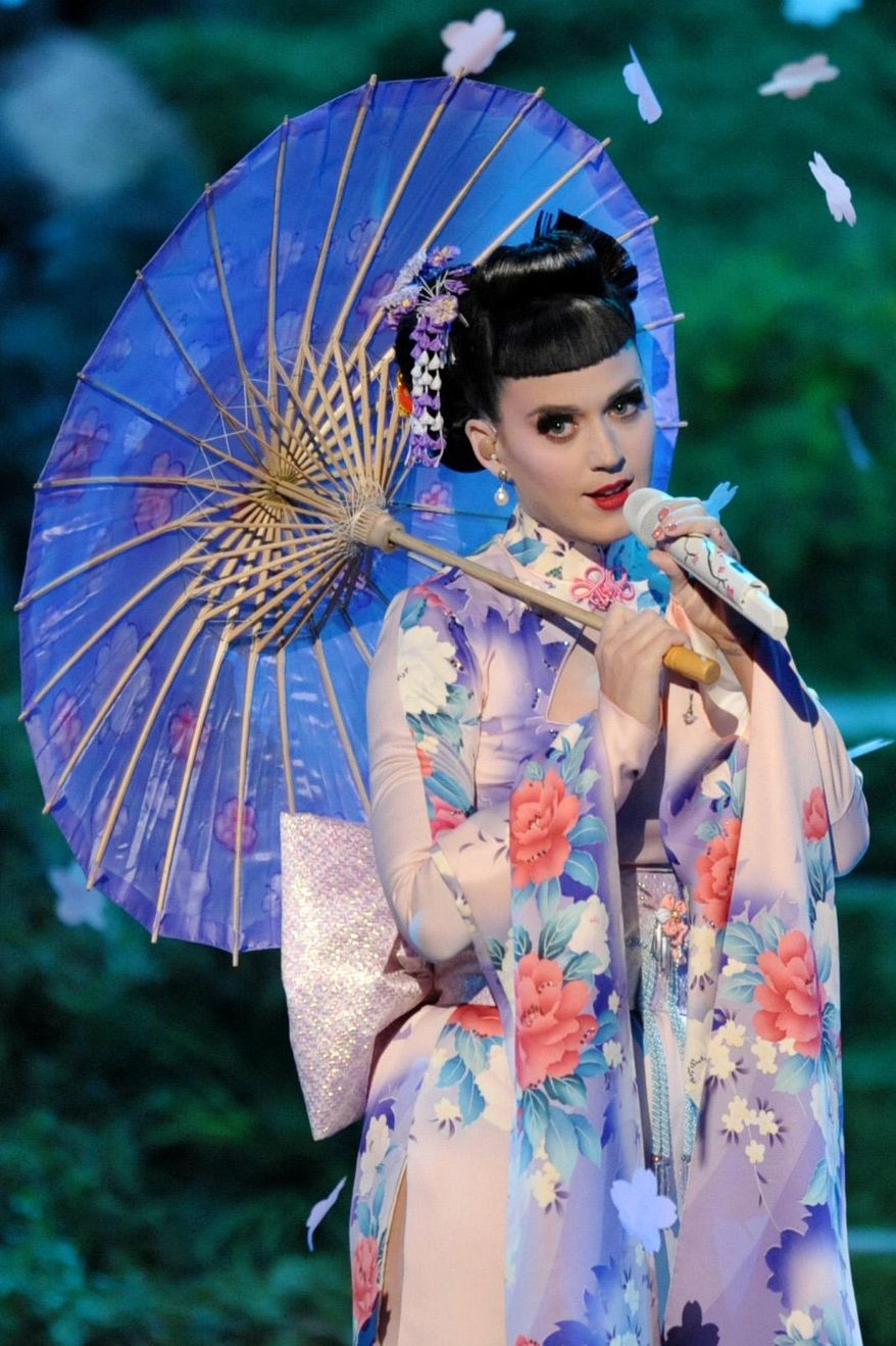 FILE - In this Nov. 24, 2013 file photo, Katy Perry performs on stage at the American Music Awards at the Nokia Theatre L.A. Live in Los Angeles. Perry scored five nominations for the People's Choice Awards airing on CBS on Wednesday, Jan. 8, 2014. The "Roar" singer is up for favorite female artist, pop artist, song, music video and fan following. (Photo by John Shearer/Invision/AP, file)
