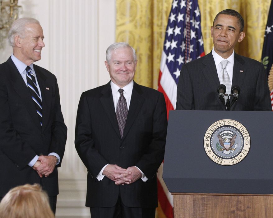 FILE - In this April 28. 2011 file photo, President Barack Obama stands in the East Room of the White House in Washington with, from left: Vice President Joe Biden and outgoing Defense Secretary Robert Gates. The White House is bristling over former Defense Secretary Robert Gates' new memoir accusing President Barack Obama of showing too little enthusiasm for the U.S. war mission in Afghanistan and sharply criticizing Vice President Joe Biden's foreign policy instincts. (AP Photo/Charles Dharapak)