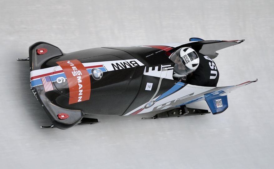 Elana Meyers and Lolo Jones of the USA compete in the women's Bobsled World Cup race in Winterberg, Germany, on Sunday, Jan. 5, 2014. Meyers and Jones finished on the second place. (AP Photo/Martin Meissner)